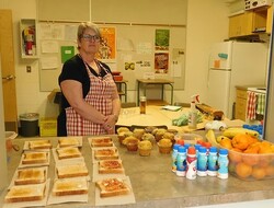 teacher with breakfast food for students